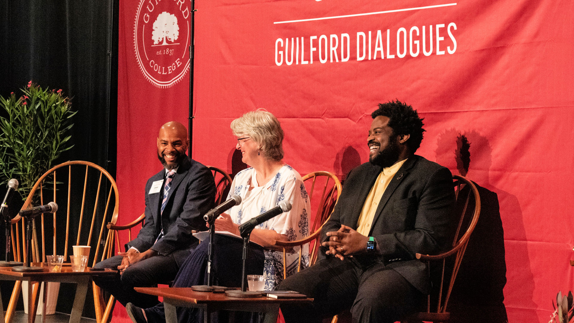 Seated on stage at the Guilford Dialogues are, from left: Lamar Thorpe, Sarah Glover, and Marcus Bass.