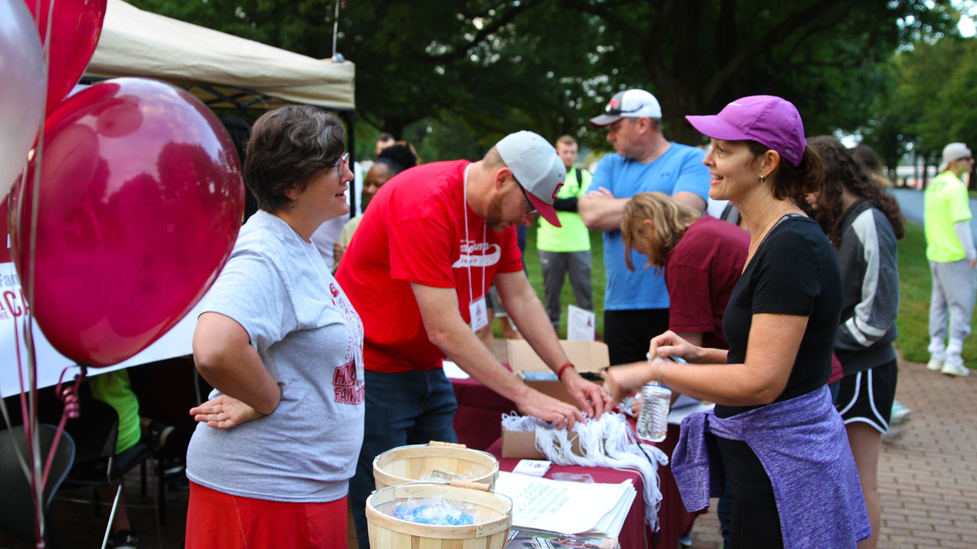 Participants receive their race numbers at the Annual Quaker 5K.