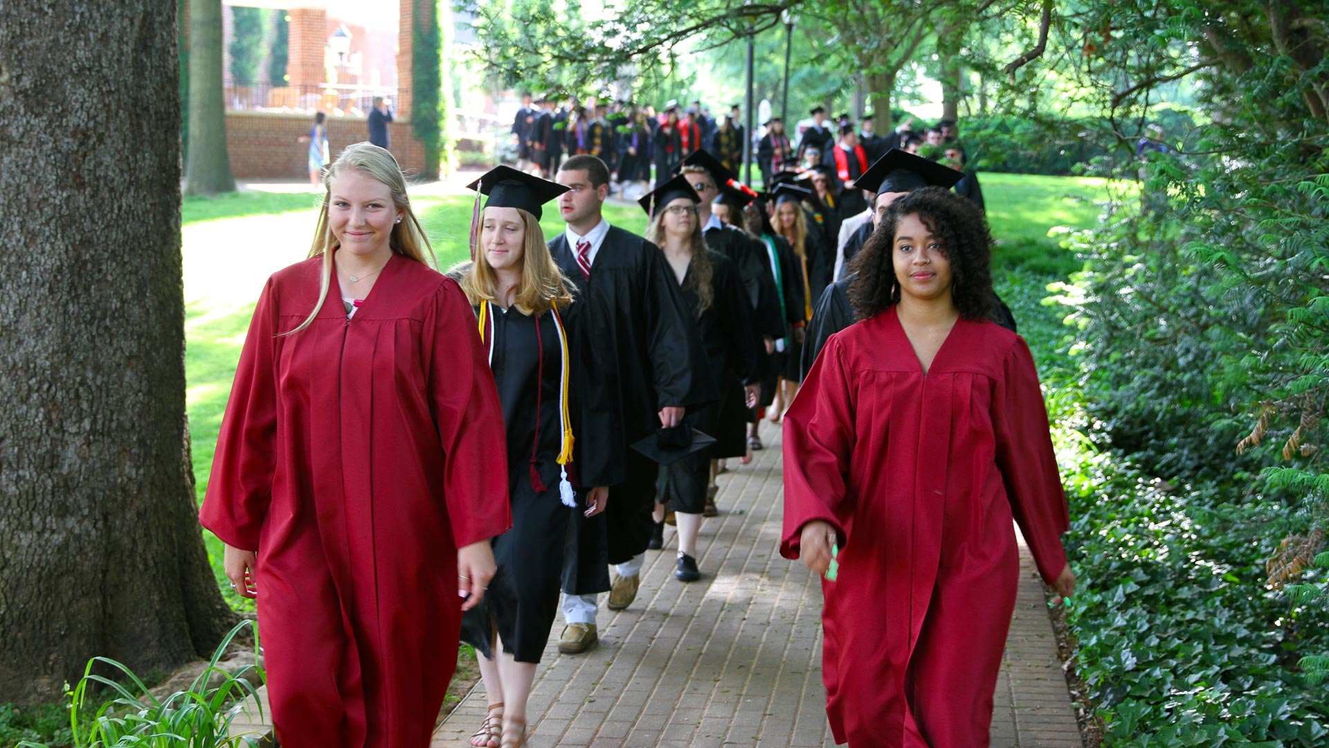 Junior marshals lead graduating students into Commencement.