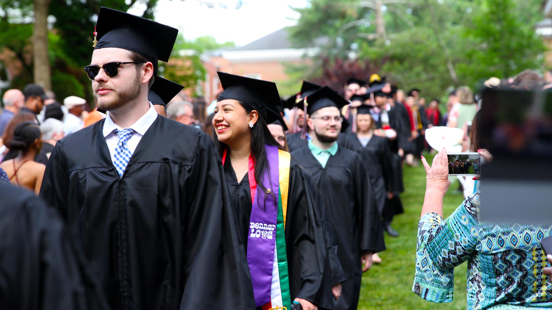 Graduating students walk into Commencement.