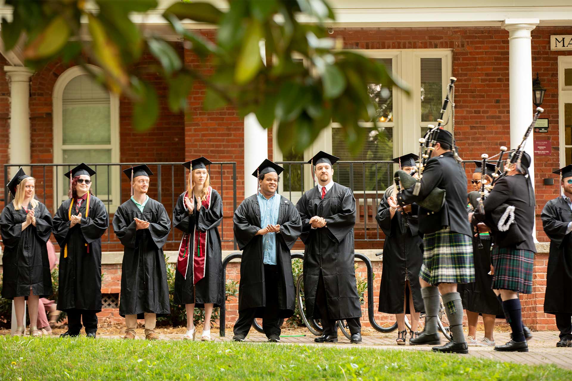 Bagpipers lead faculty to the Commencement ceremony.