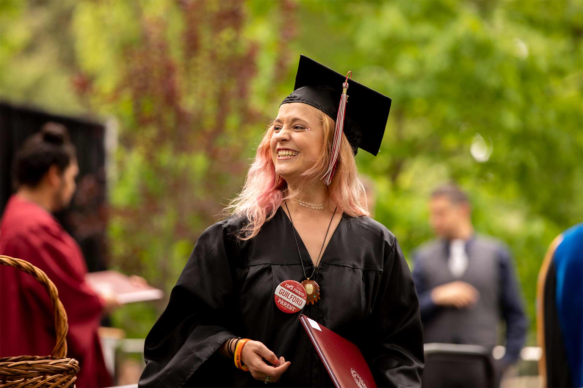 A student receives a diploma at Commencement.