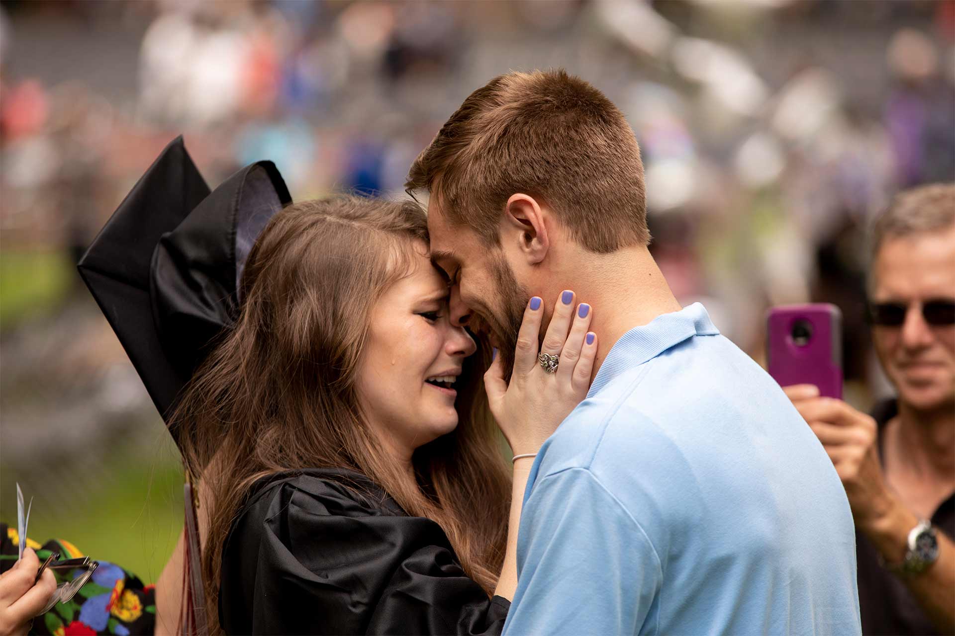 Mary-Hannah Bunting '18 celebrates with her new fiancé, Ty Levesque — who proposed right after the program — at Commencement.