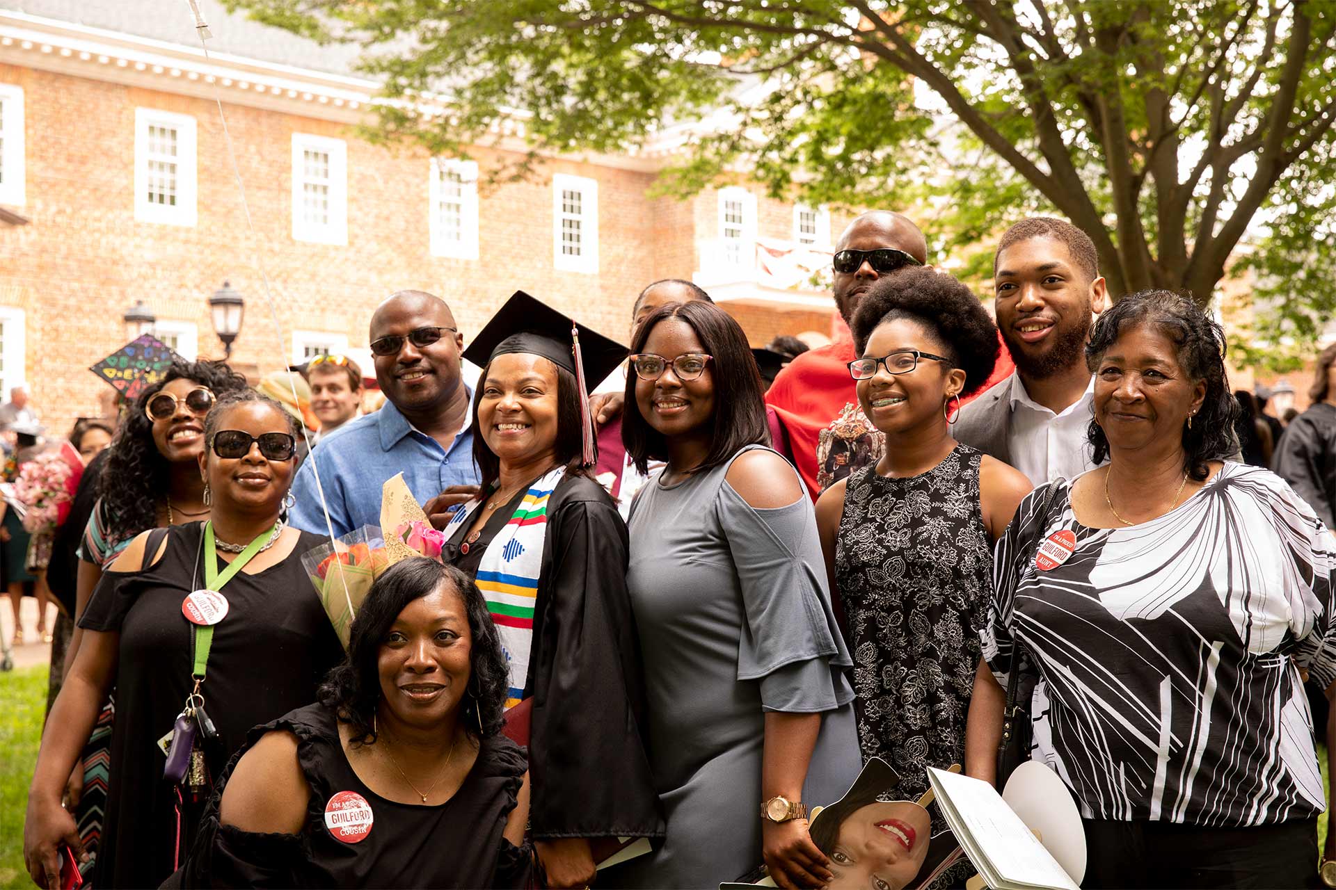 Friends and family pose for a photo after Commencement.