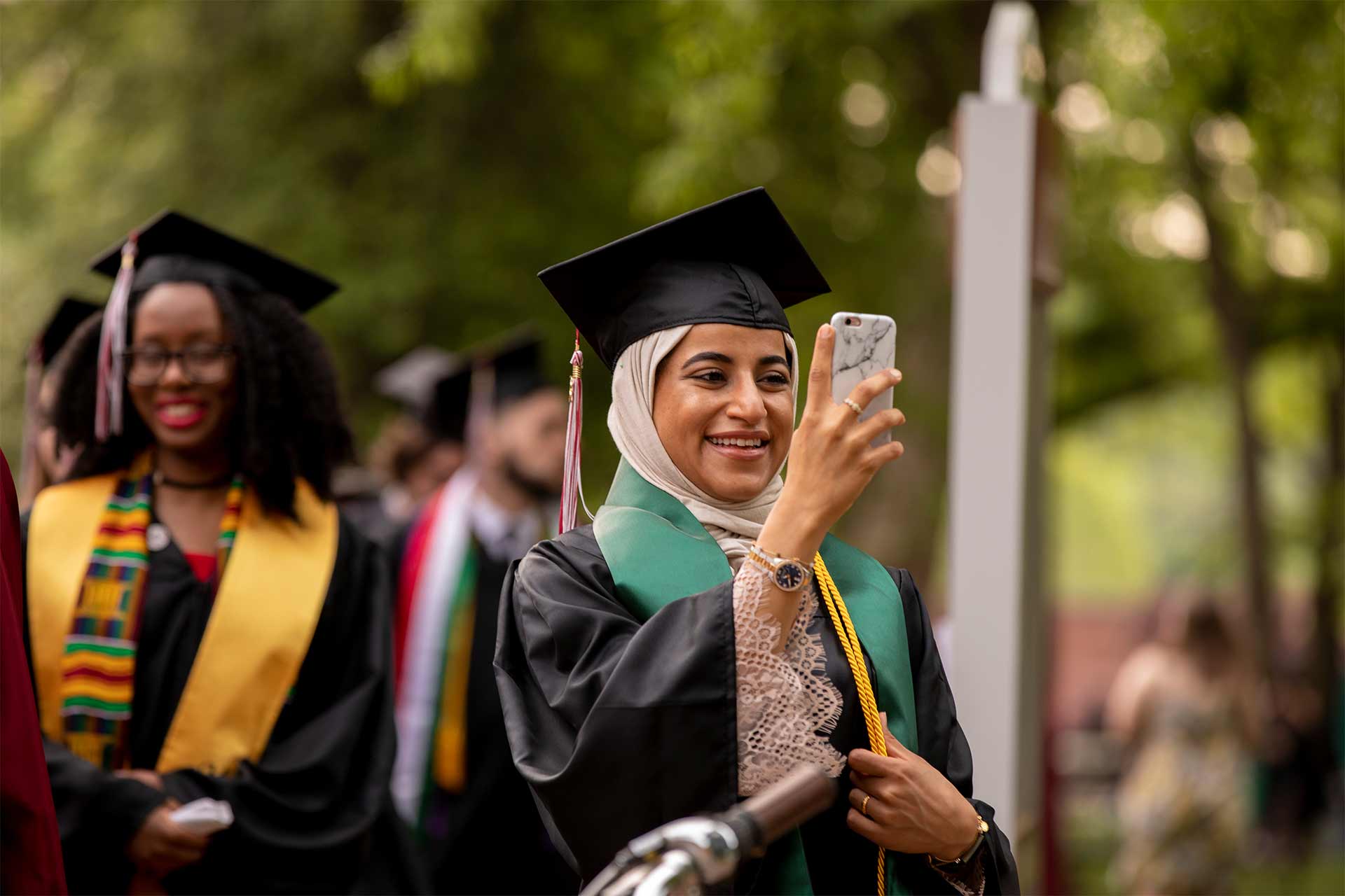 Student takes a selfie at Commencement.