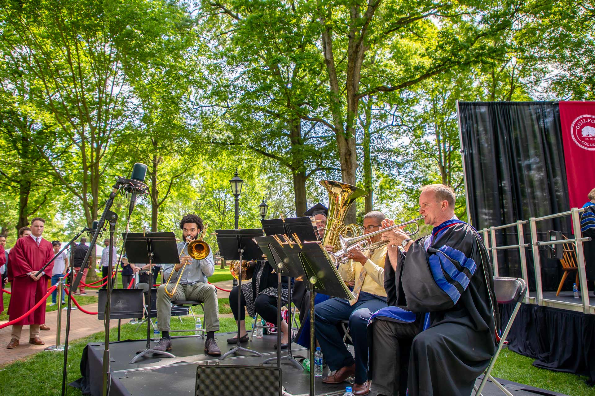 A band plays music on the Quad after Commencement.