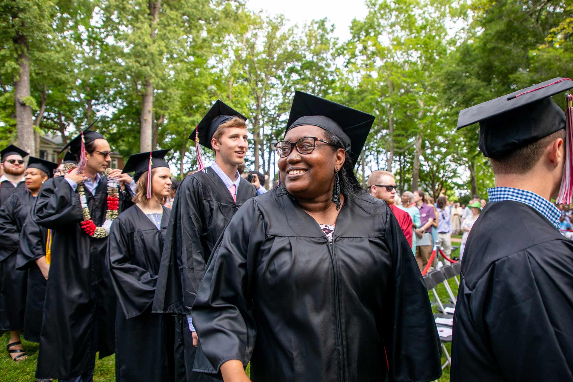 Graduating students walk to Commencement.