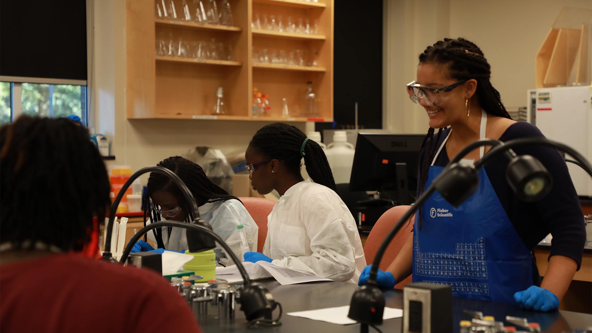 Guilford students mentor middle school students in the lab.