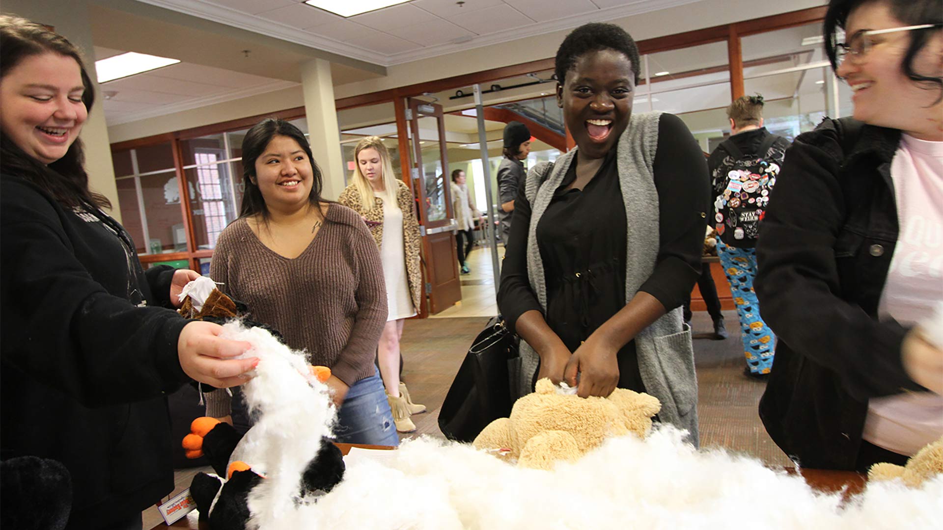 Students making toys at the Stuff and Plush event for Guilford LOVE.