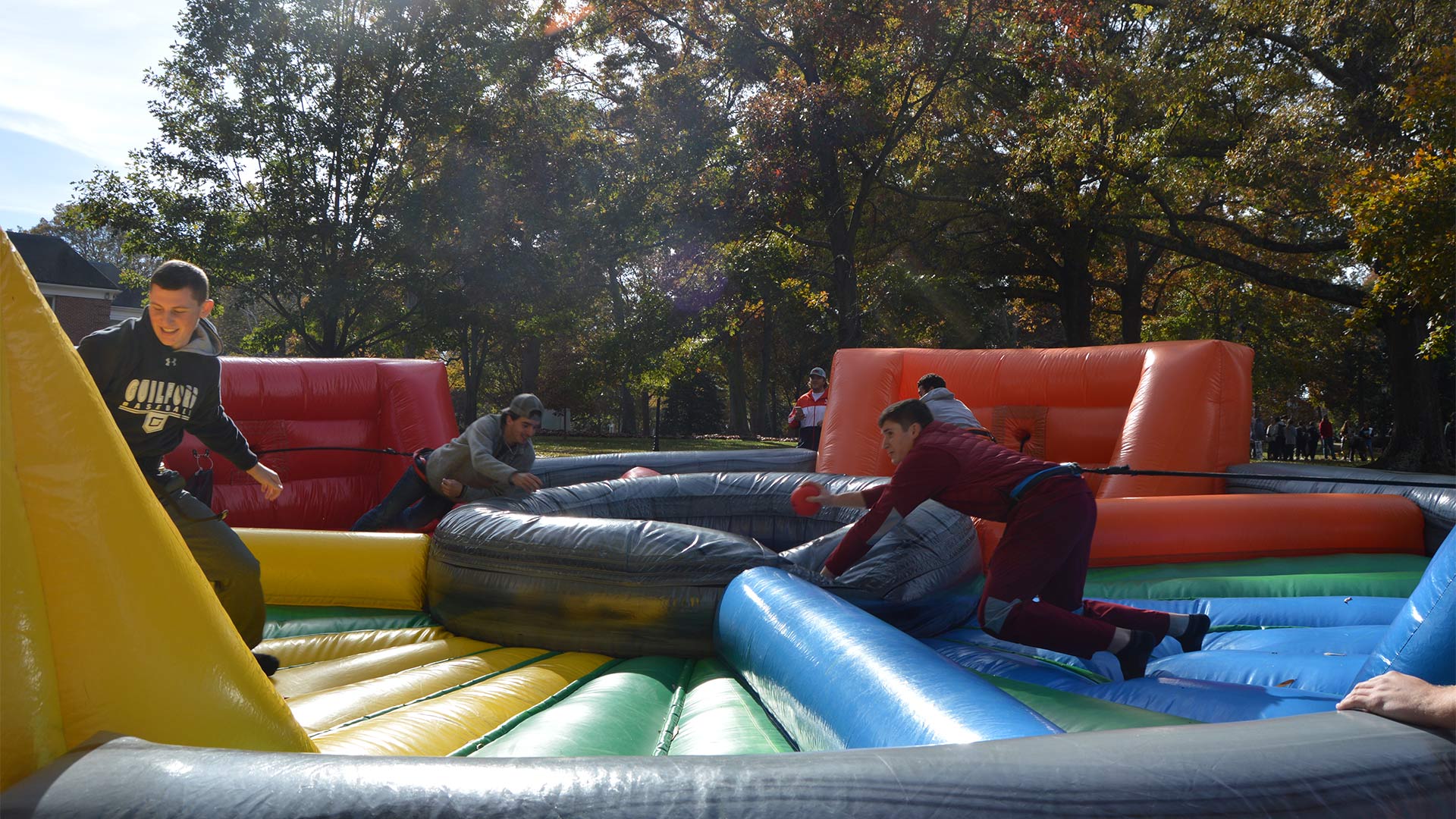 Students participate in the life-size version of Hungry Hungry Hippos.