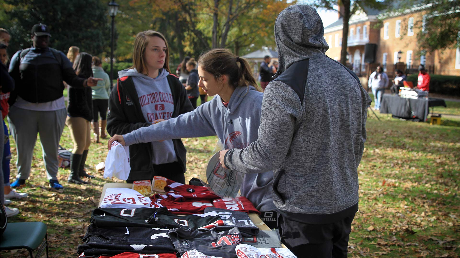Students grab free t-shirts during the event.