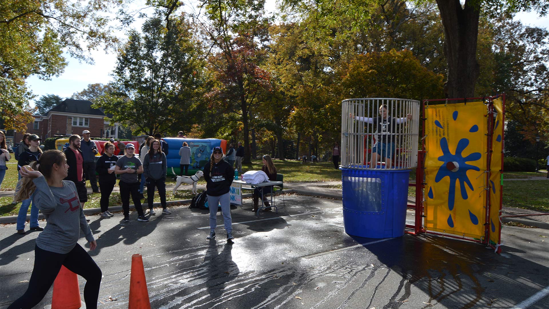 A student takes aim at the dunk tank during the Sports Spectacular.