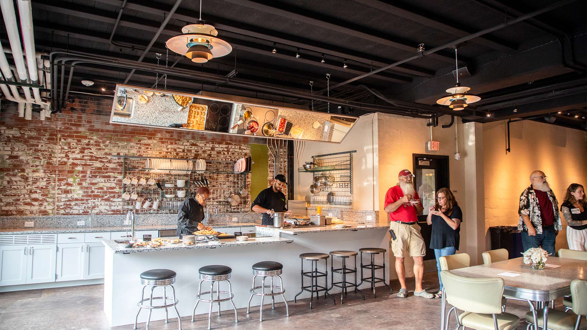 A large demonstration kitchen with granite counters, stainless steel appliances and a demonstration mirror for cooking classes is a major feature of the new space.
