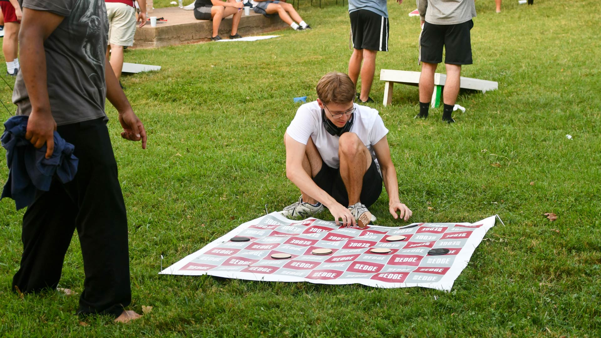 Students play a lifesize game of checkers at EdgeFest.