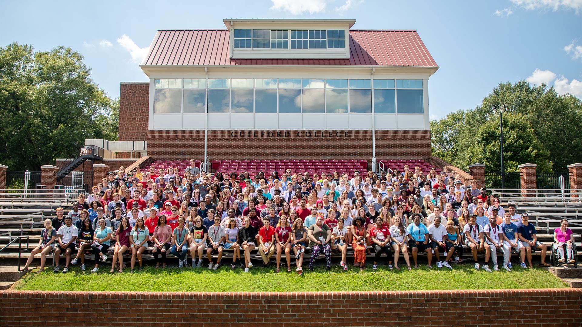 The Class of 2023 gathers in the football stadium for a class picture.