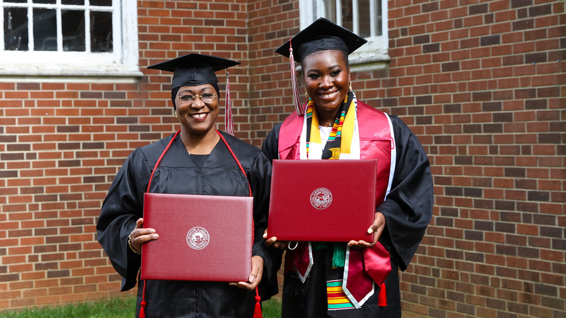 Mother-daughter graduates from the class of 2020 take a photo together on Mother's Day weekend.