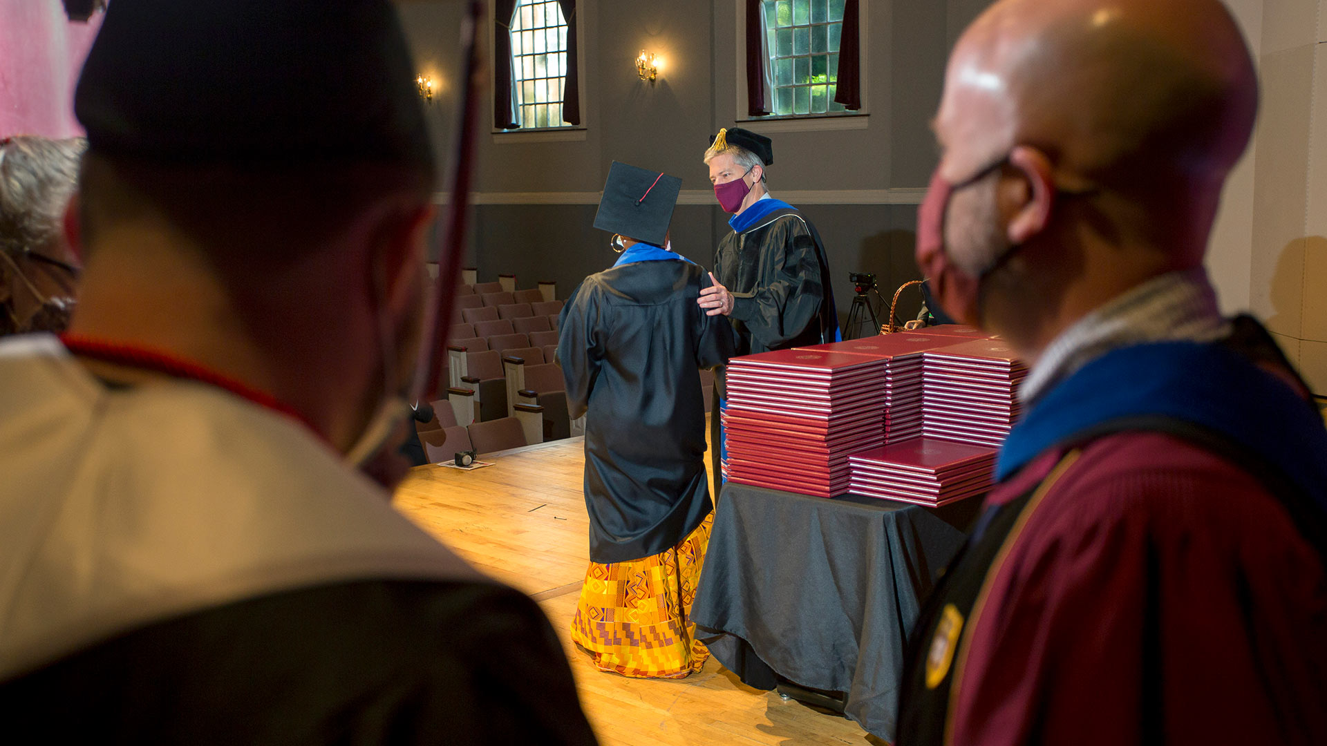 This photo taken from backstage in Dana Auditorium shows the Commencement ceremony in progress.
