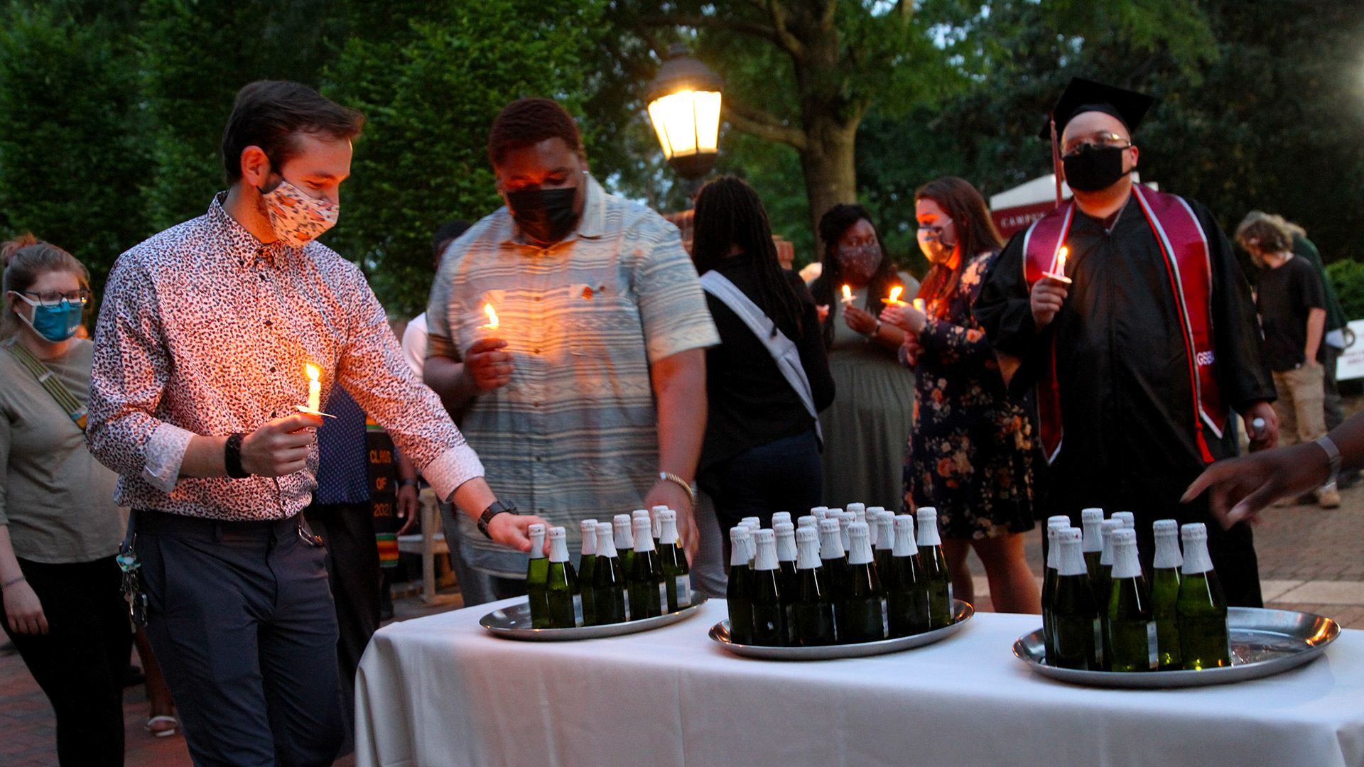 Sparkling cider is poured for the Toast to the Light 2021.