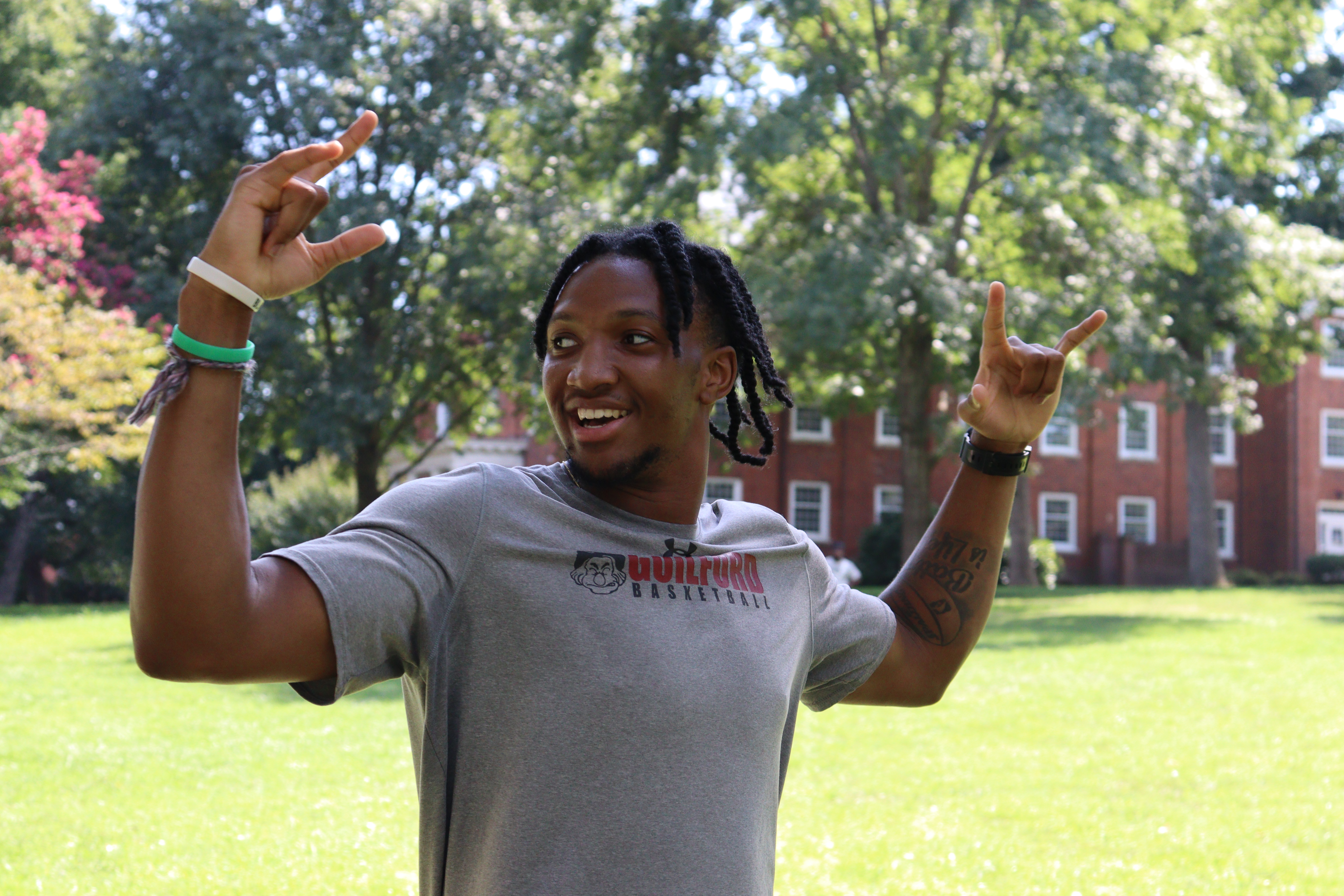 A student cheers during the kickball game on the Quad.