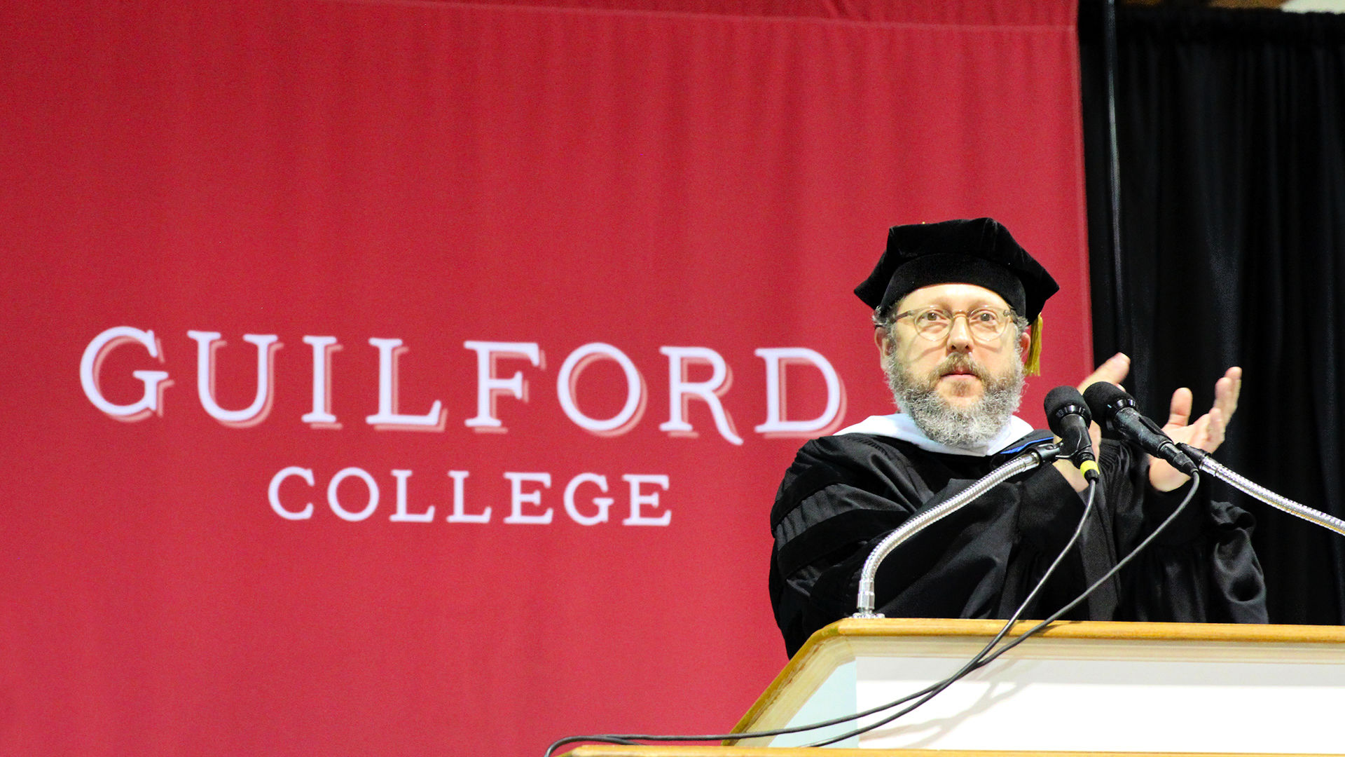 Friends Center Director Wess Daniels speaks from the podium at the start of Commencement.