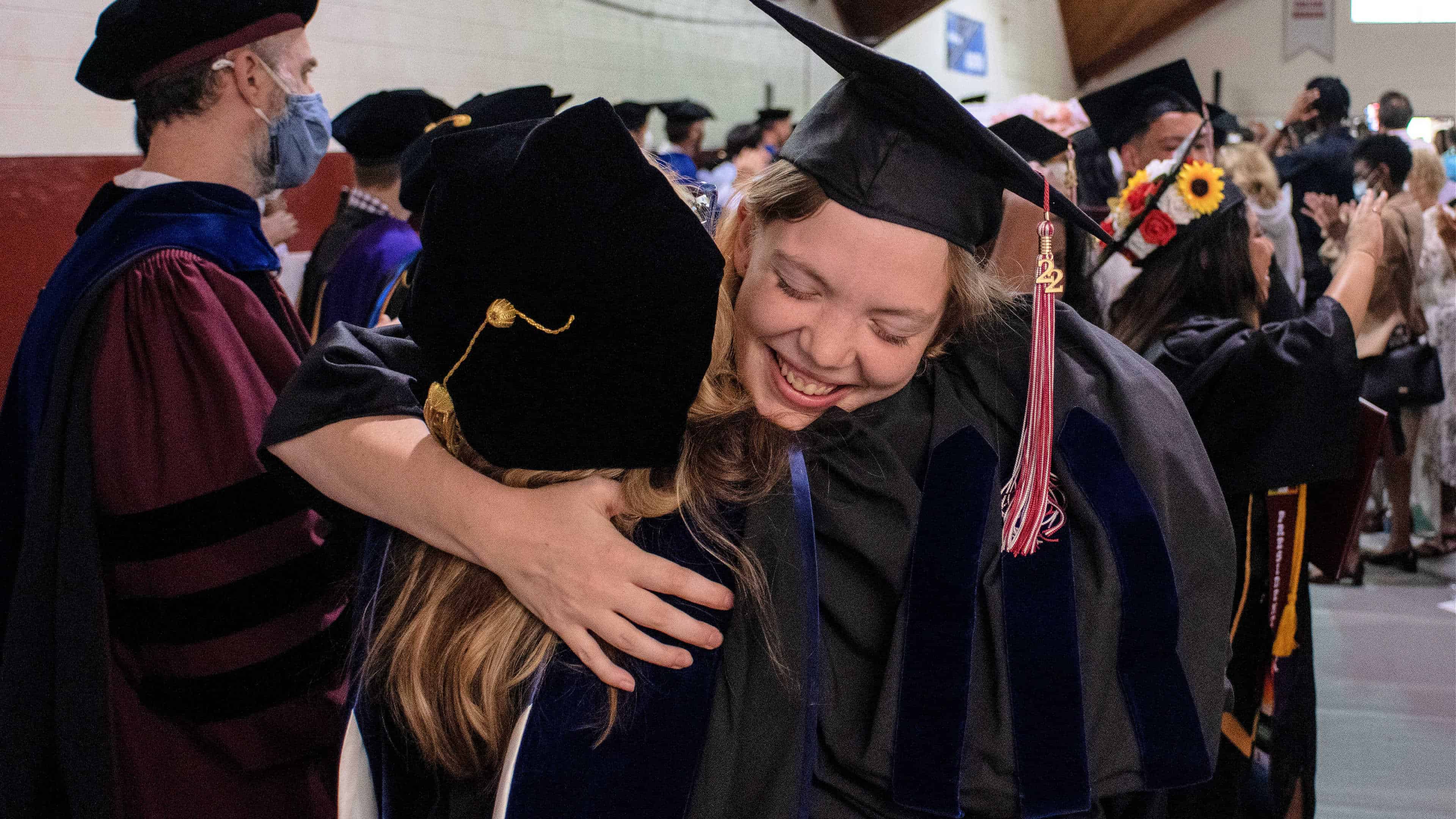 An honors student hugging Heather Hayton after Commencement.