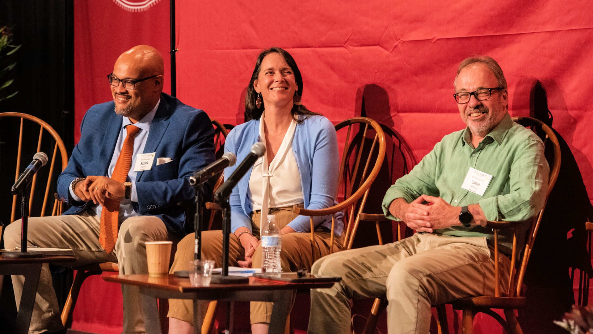 Seated on stage at the Guilford Dialogues are, from left: Russell Fugett, Wendy Bolger, and Simon Gifford.