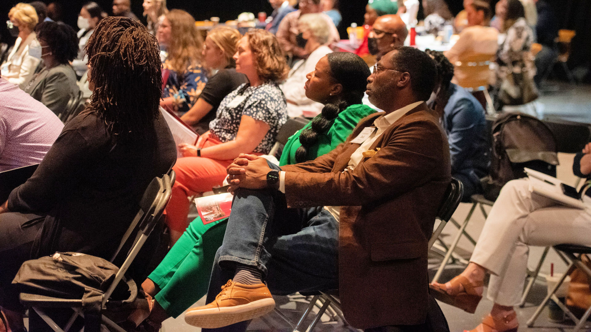 Visitors fill the seats in the auditorium during Guilford Dialogues presentations.