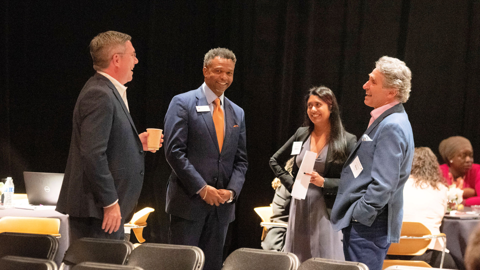 Standing together, chatting before their presentations, from left are Graham Macmillan, Danny Gatling, Roberta Lobo, and Byron Loflin.