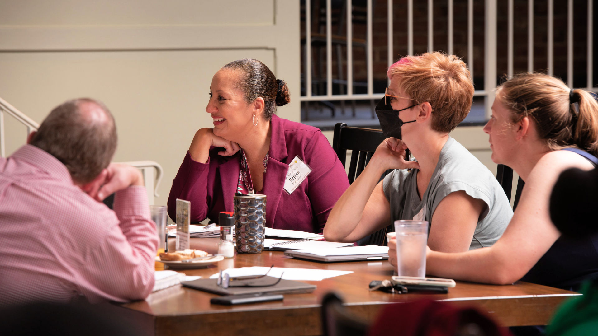 Attendees chat during their final meeting of the Guilford Dialogues.