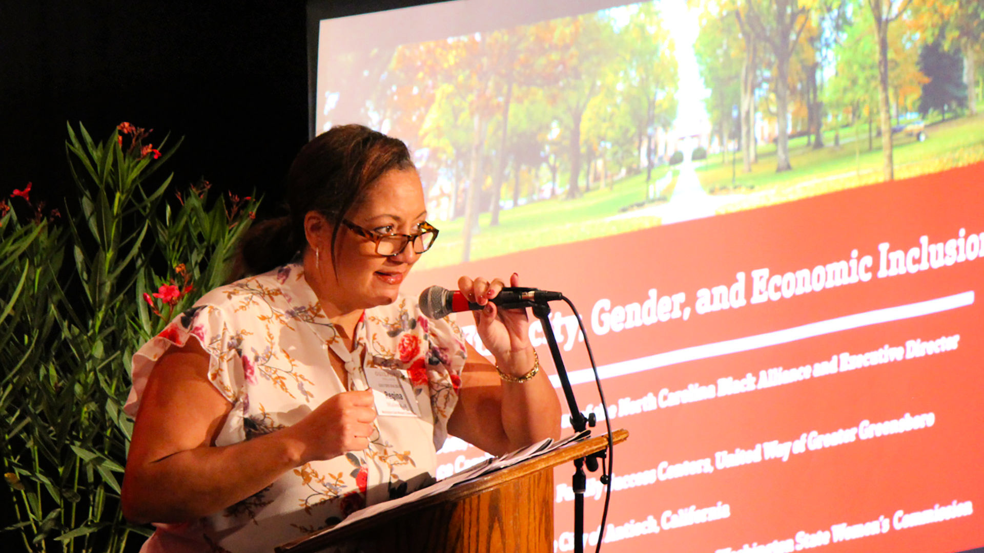 Regina Malveaux speaks on stage at the Guilford Dialogues.