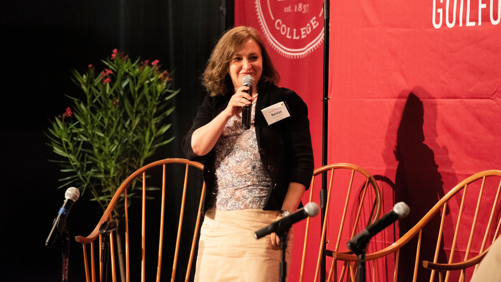 Natalya Shelkova speaks on stage during the Guilford Dialogues.