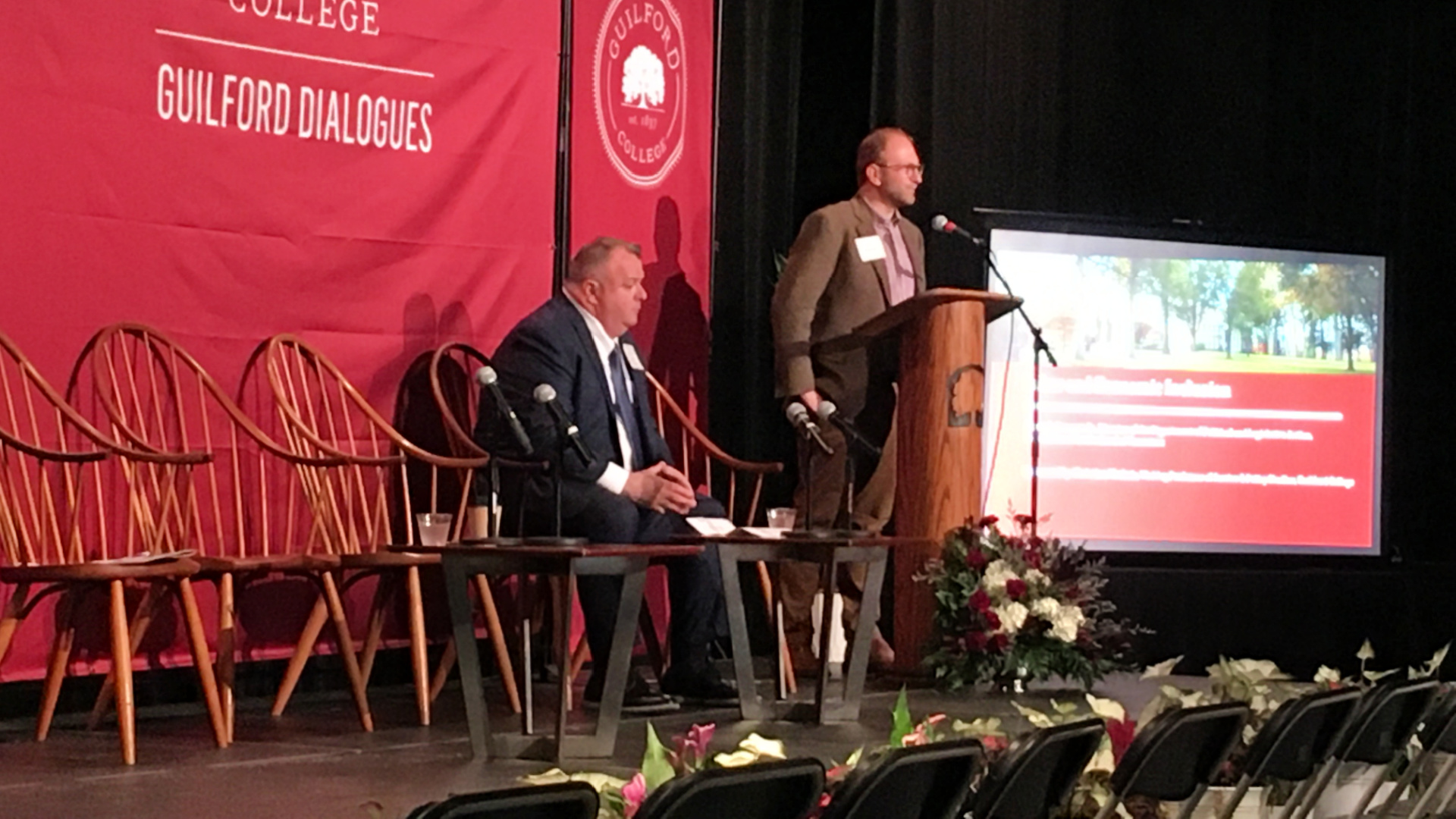 On stage during the Guilford Dialogues, from left: James Donovan and Christian Matheis.