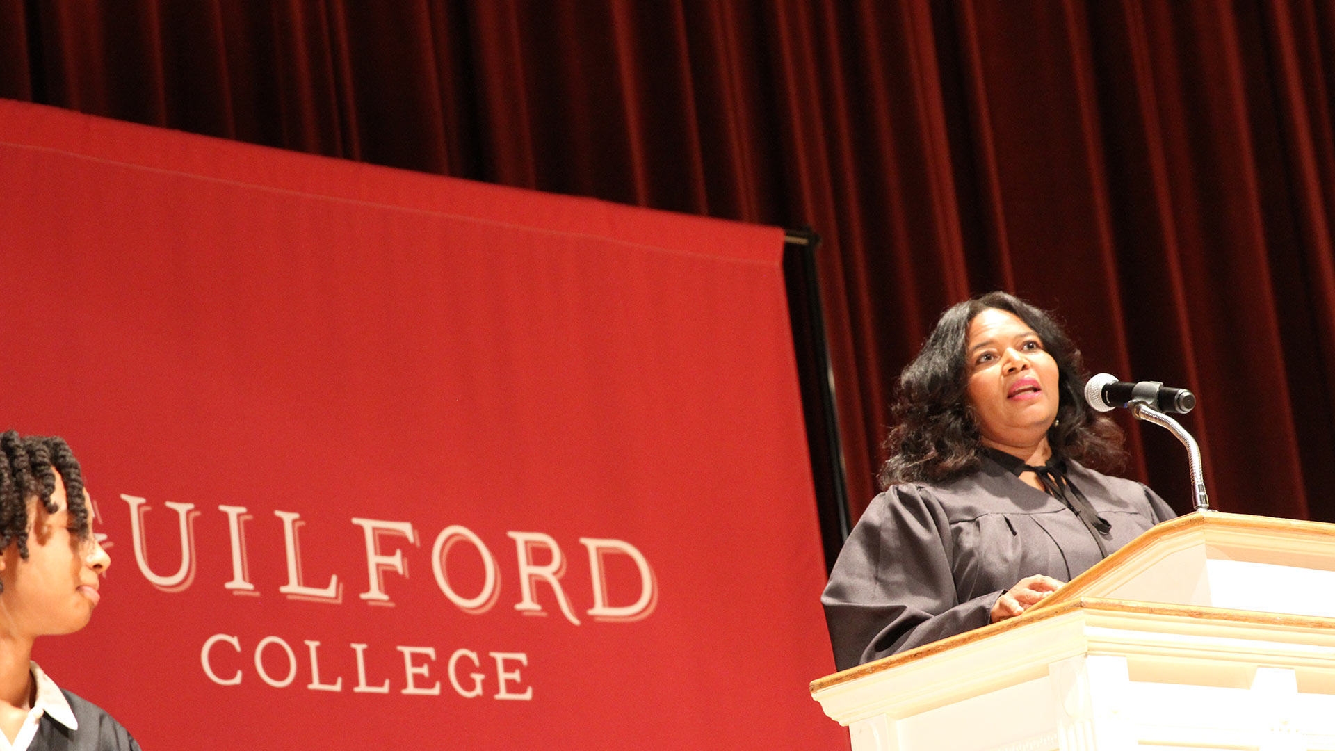 Toiya Hancock ’93, President of Black Alumni of Guilford College, speaks from the podium at Convocation 2022.