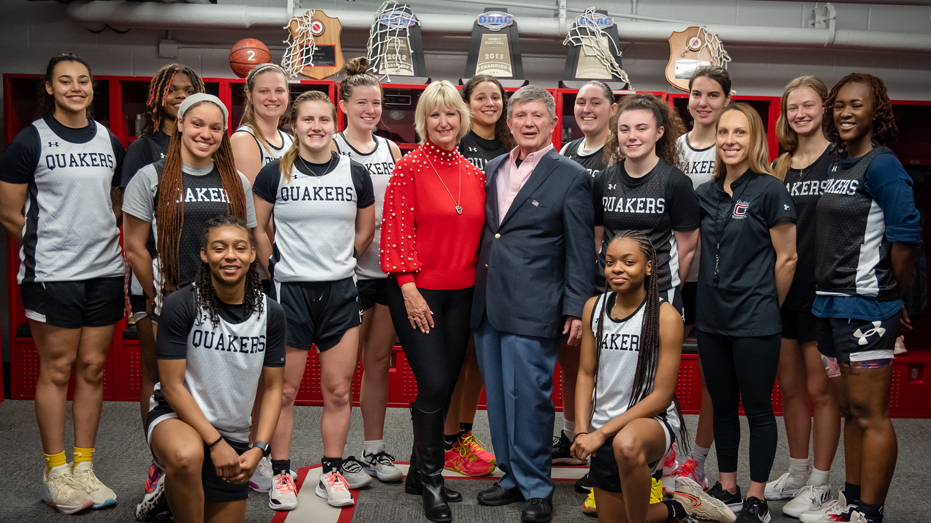 Women’s basketball team with Rich Ulmer and his daughter, Karen Ulmer Mohr, at the dedication of the renovated Audrie Gardam Ulmer ‘41 locker room.
