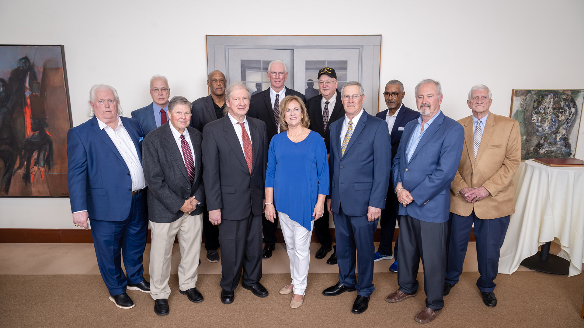 Members of the 1973 men’s basketball team and Marsha Jensen ’74, spouse of the late coach Jack Jensen.