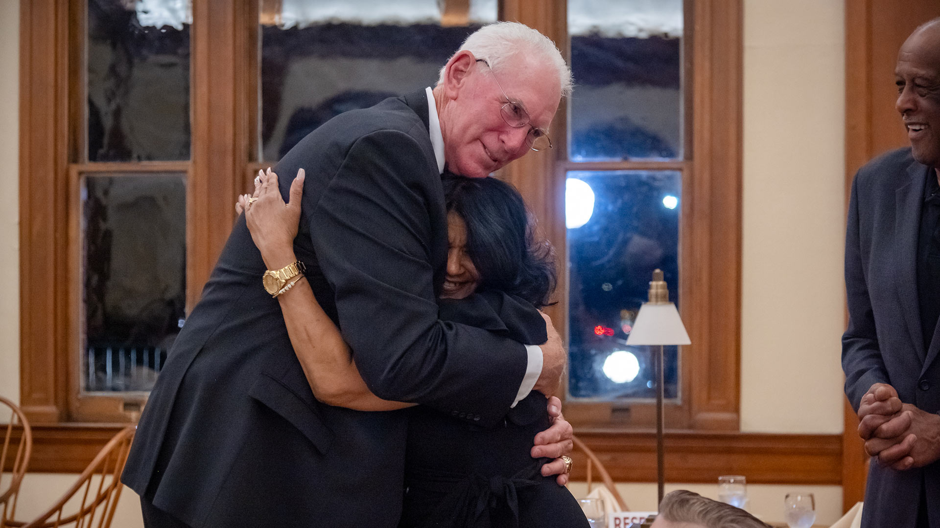 Ray Massengill ’75 and Kim Jackson, widow of Greg Jackson '74, hugging at the dinner.