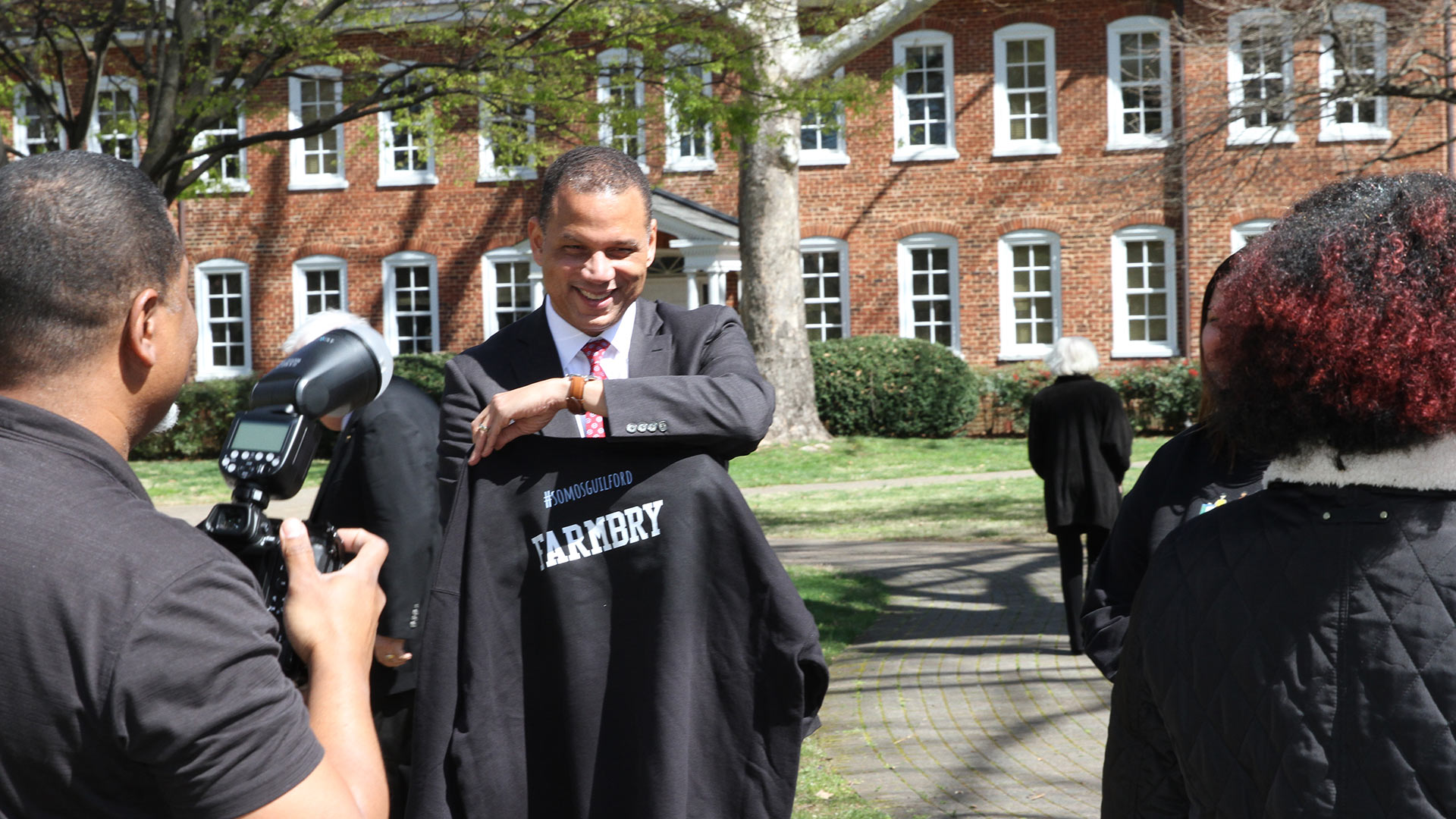 Hispanos Unidos de Guilford presents Kyle Farmbry with a jersey.