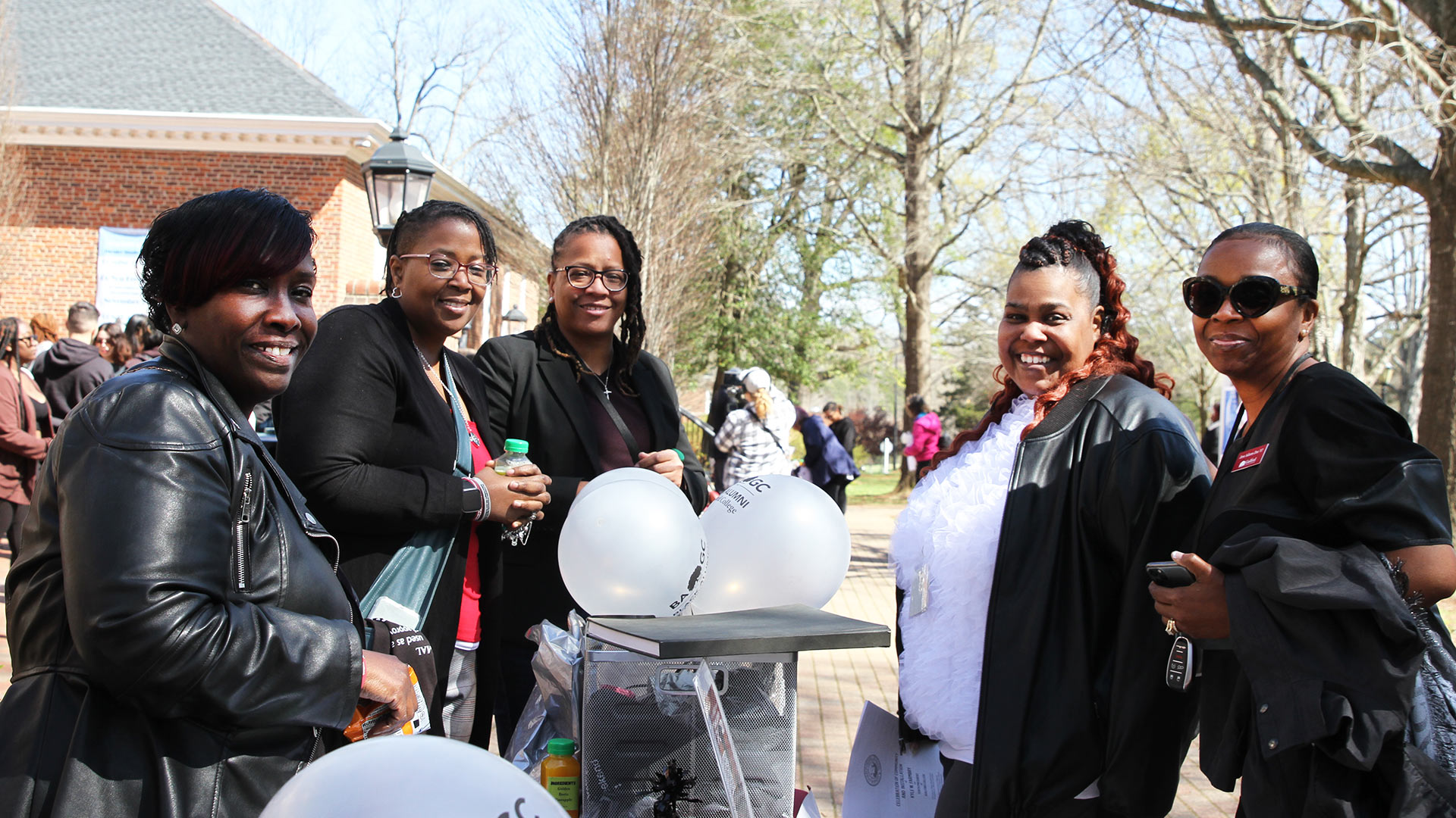 Members of Black Alumni of Guilford College gathered in front of Founders Hall.