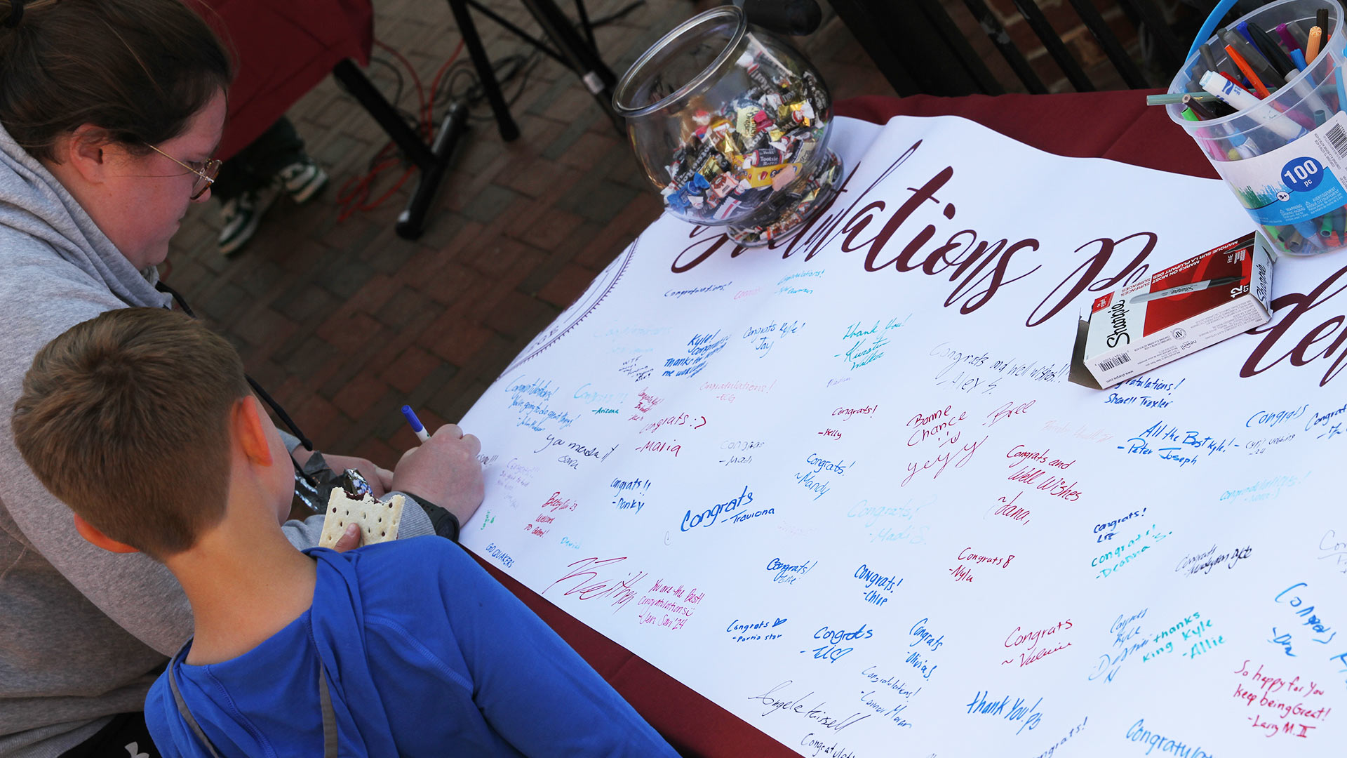 Attendees signed a banner for Kyle Farmbry.