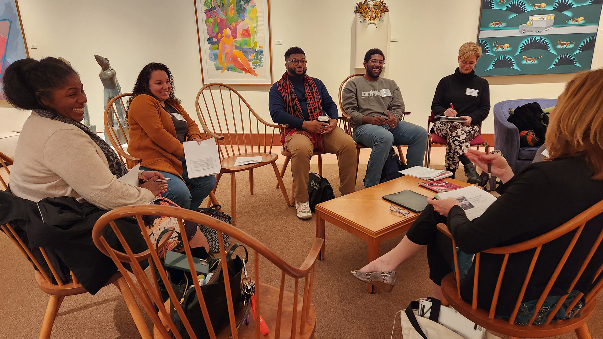 A breakout workshop in the Guilford College Art Gallery discussing Art Education.