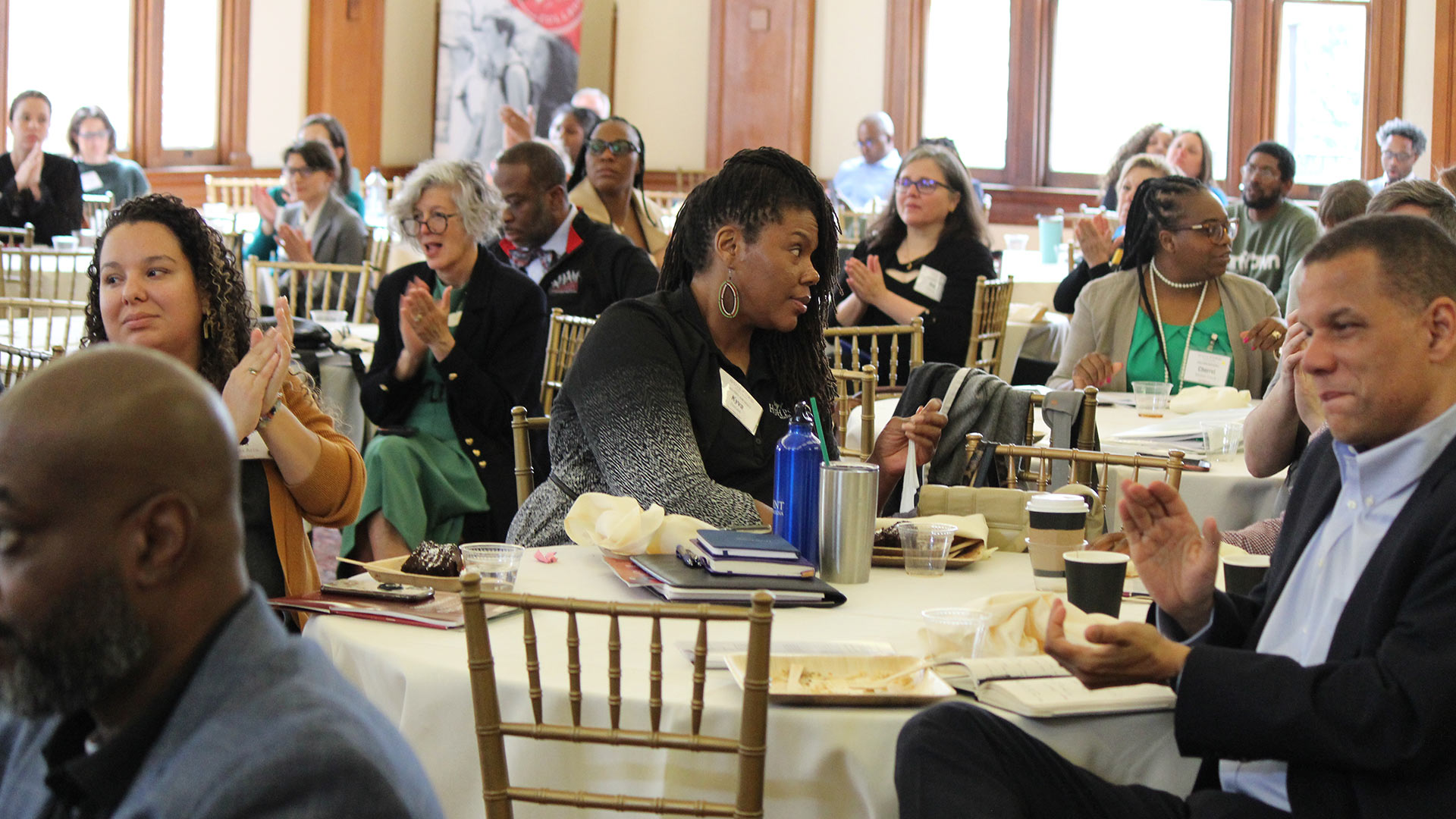 Engaged audience members during a panel discussion.