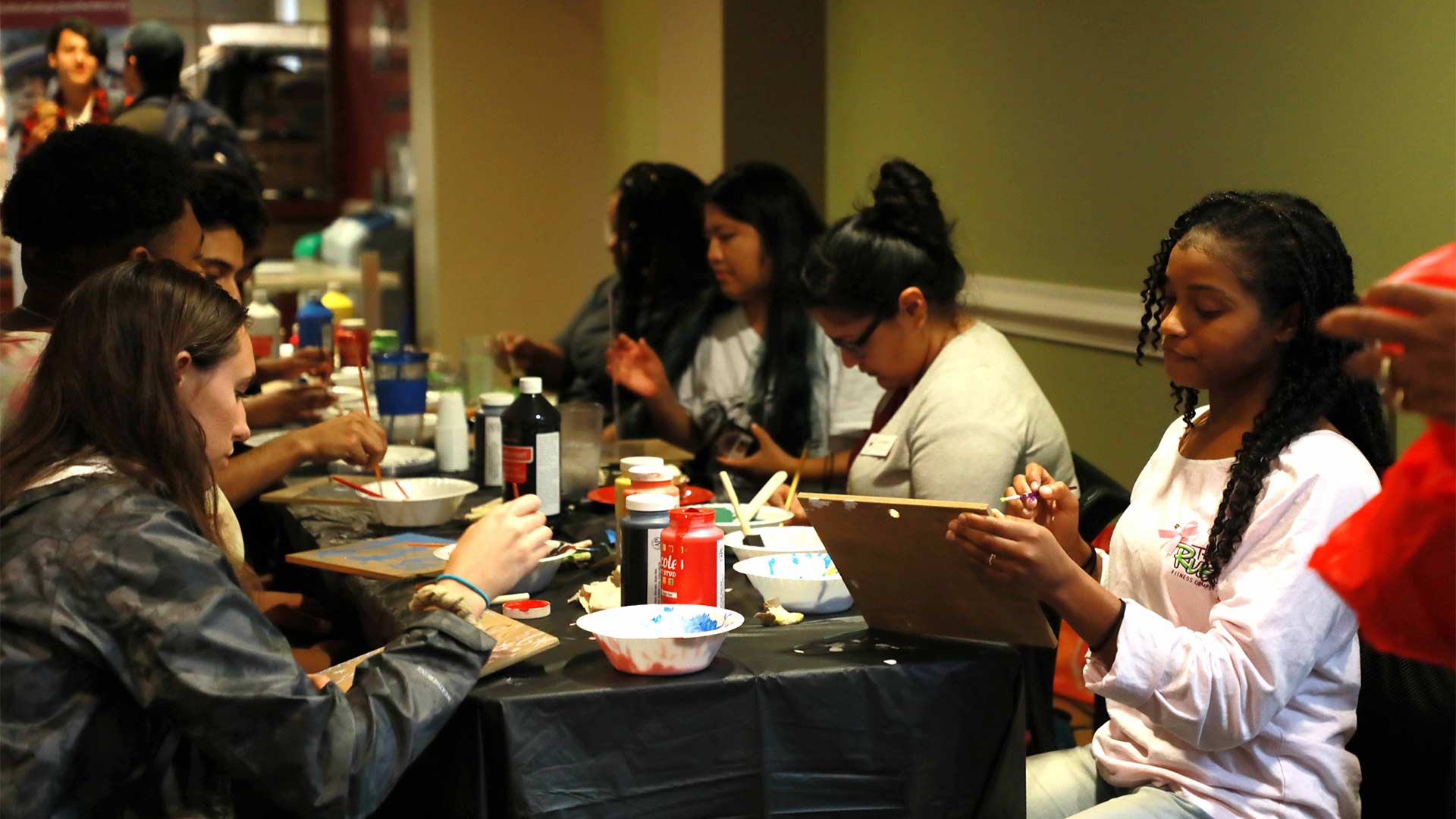 Students craft together indoors.