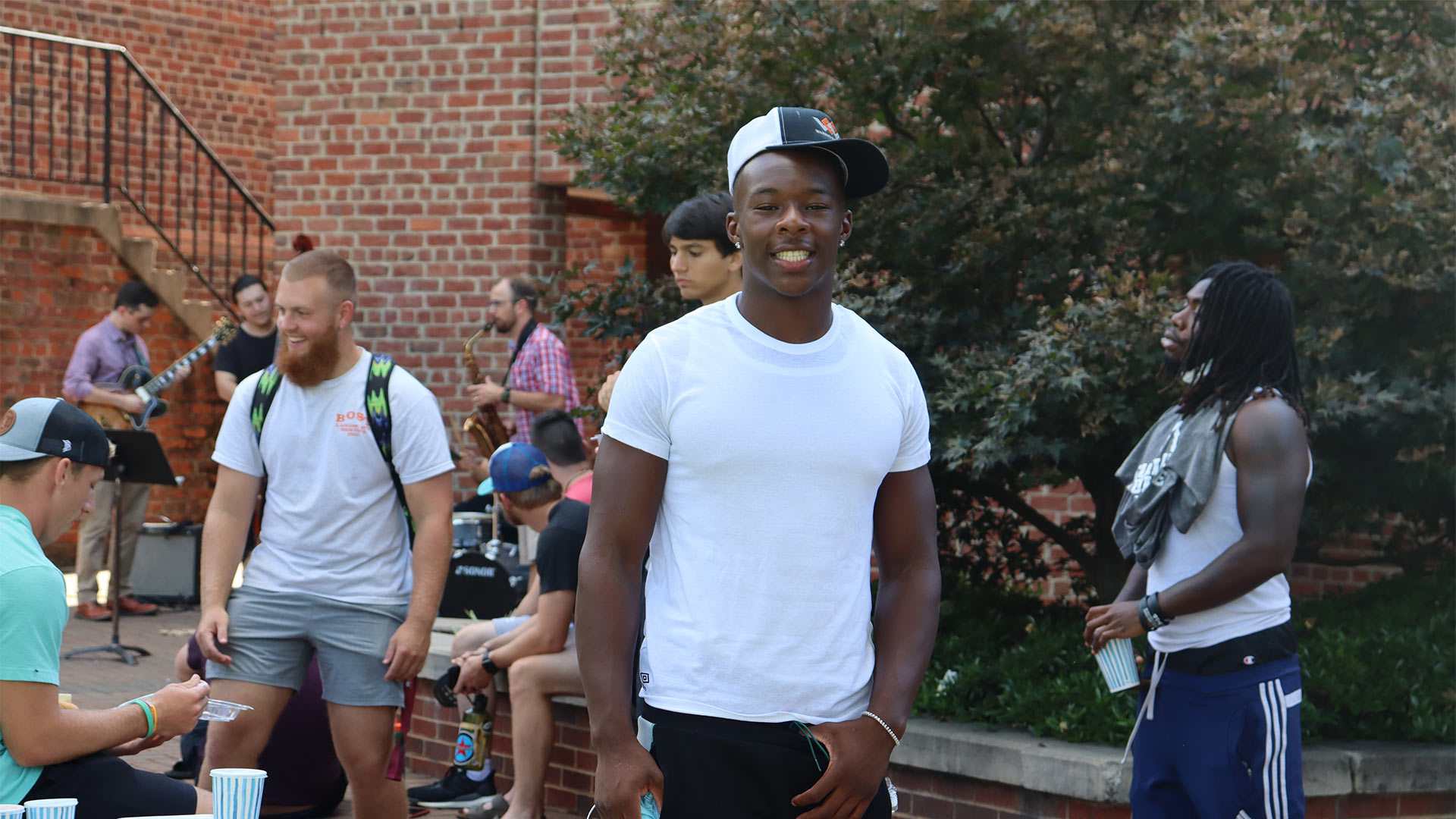 Students gather on the patio behind Founders to enjoy the jazz performance.