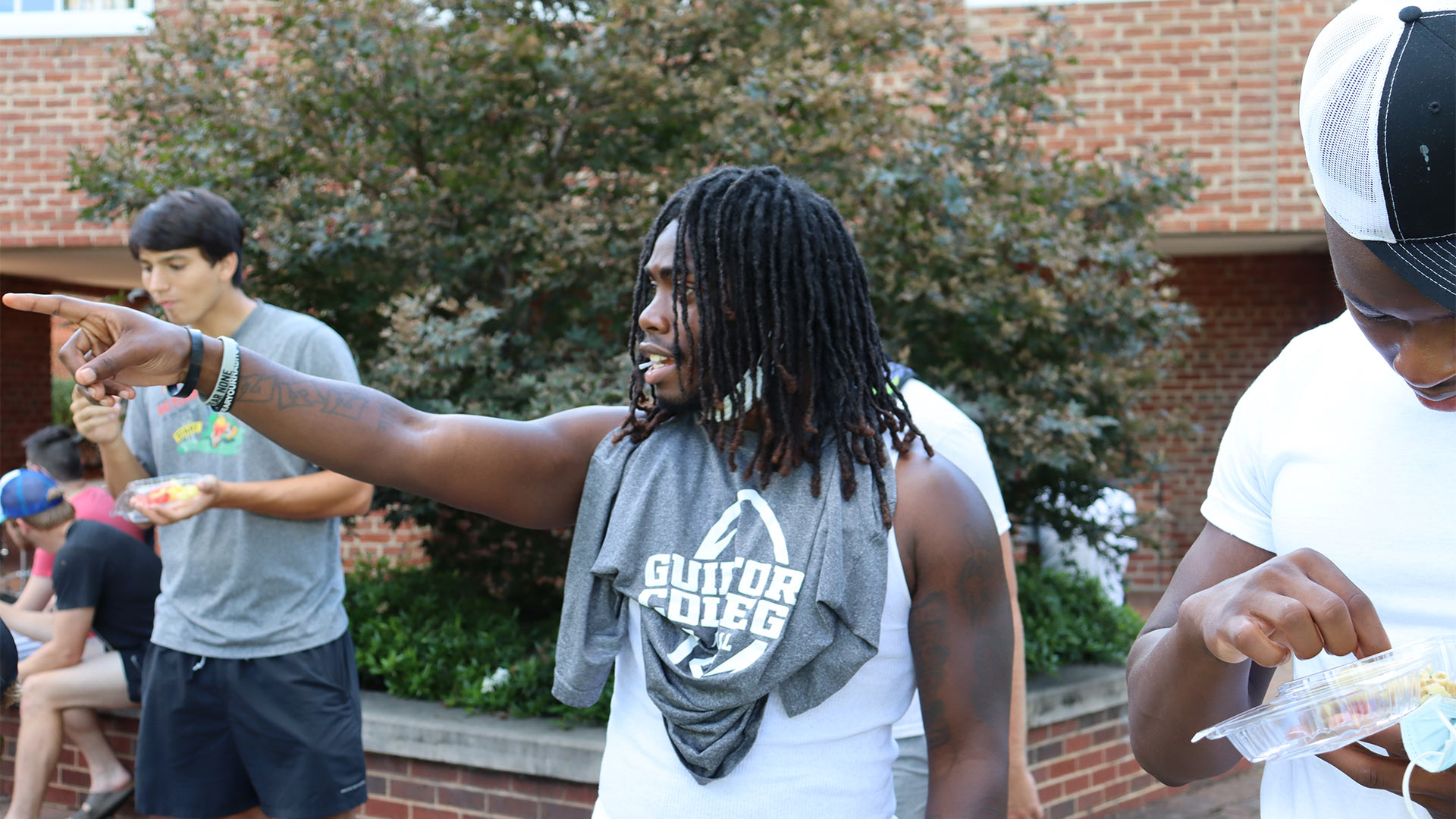 Students point at their friends who join them to enjoy the jazz performance.