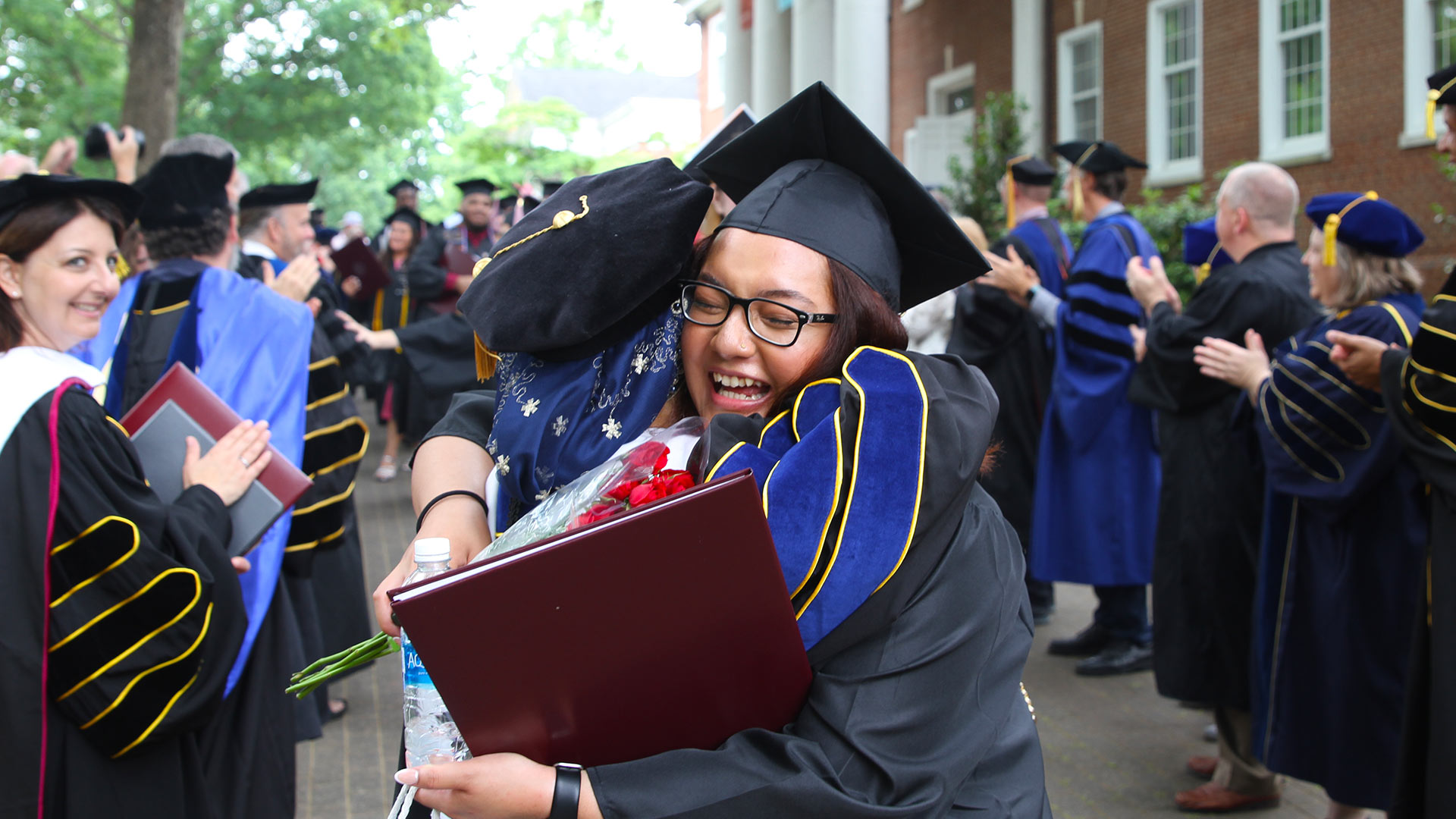 Zhihong Chen congradulates a graduate