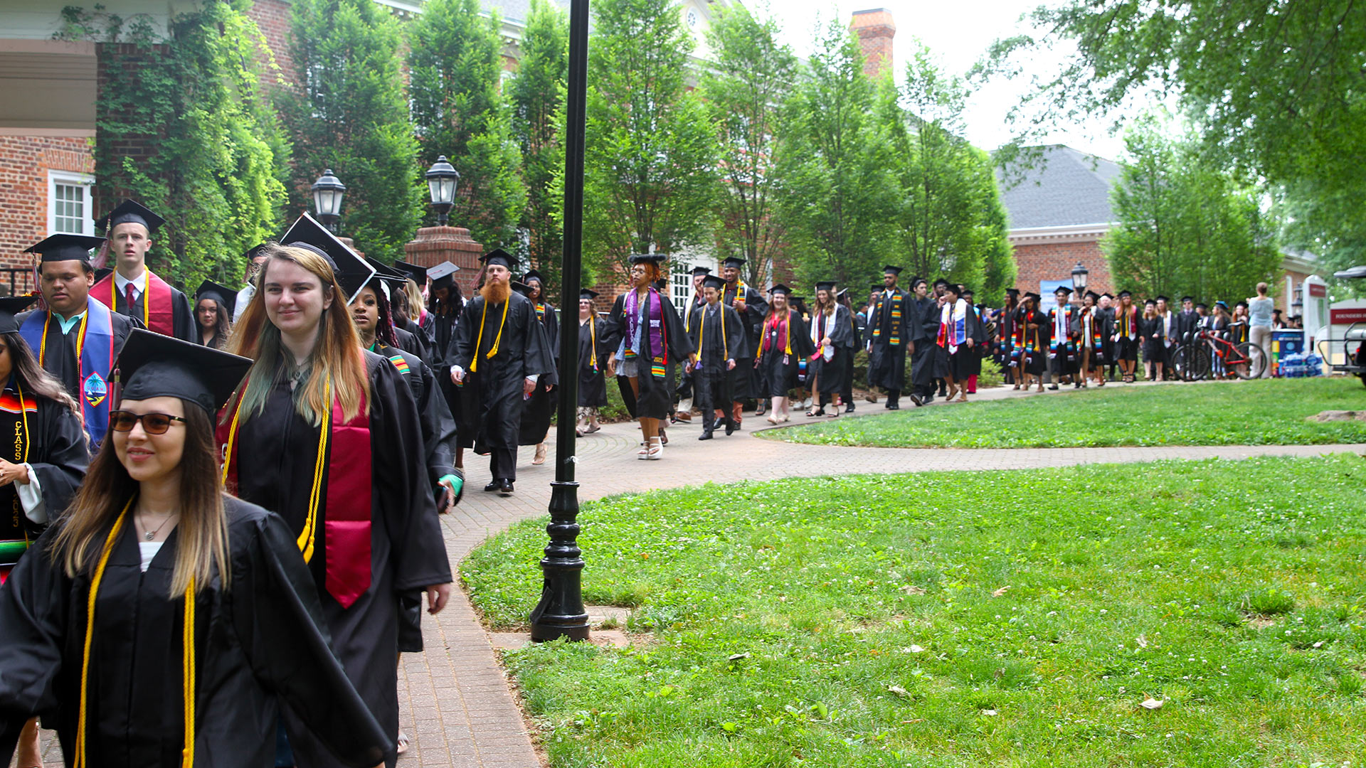 Walking in front of Founders Hall