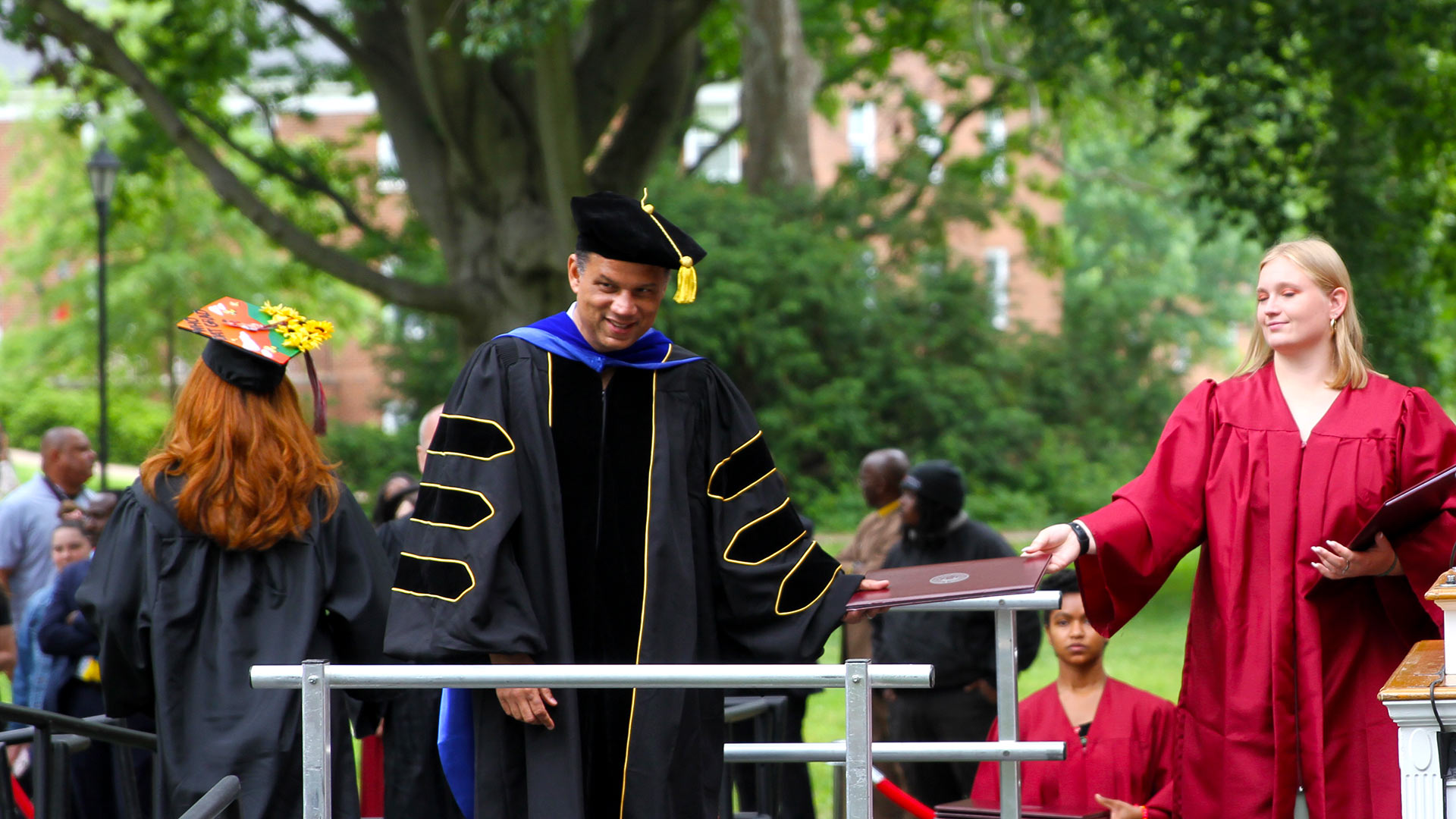 Welcoming a graduate to the stage