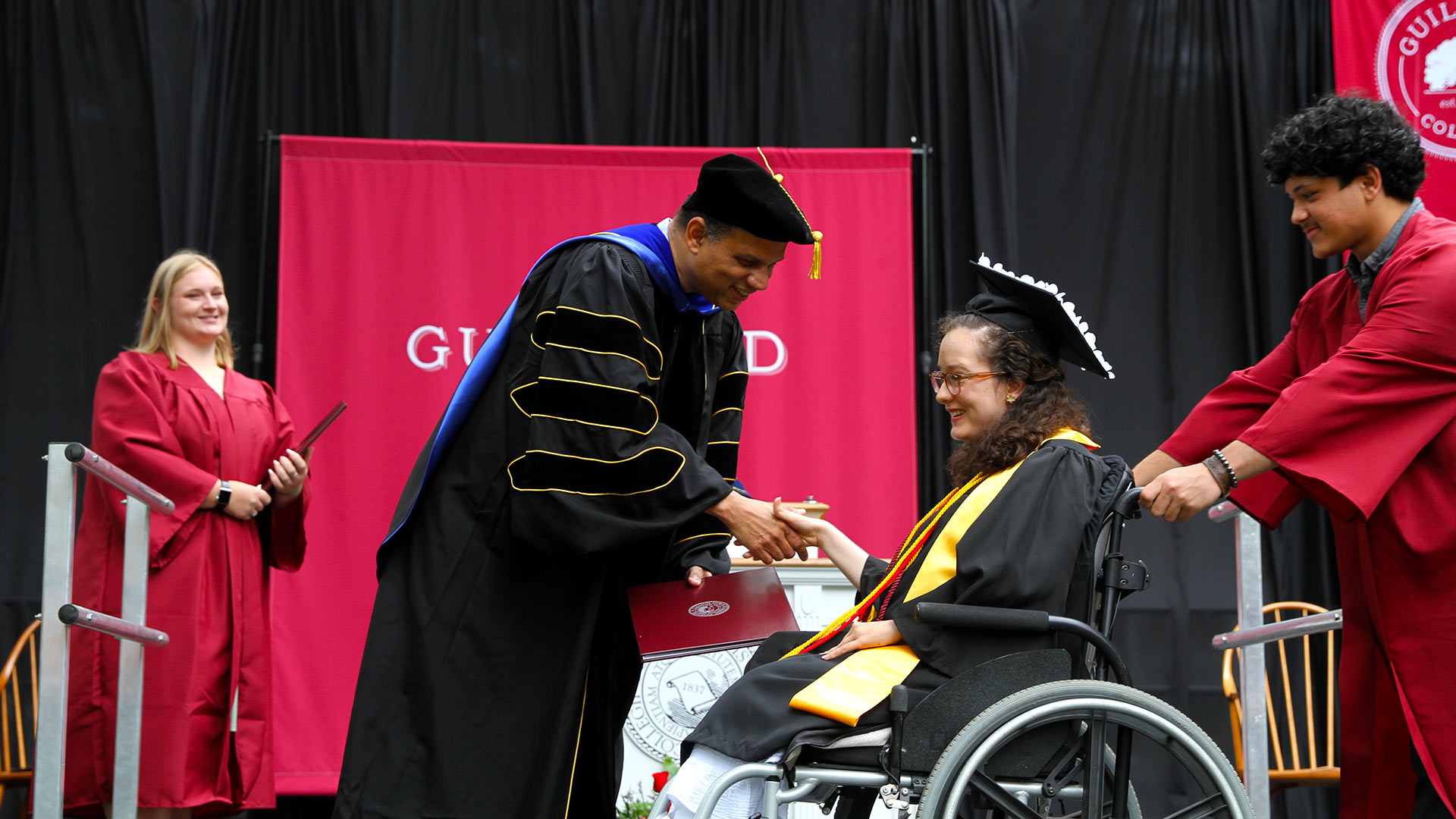 President Kyle Farmbry congradulates a Graduate