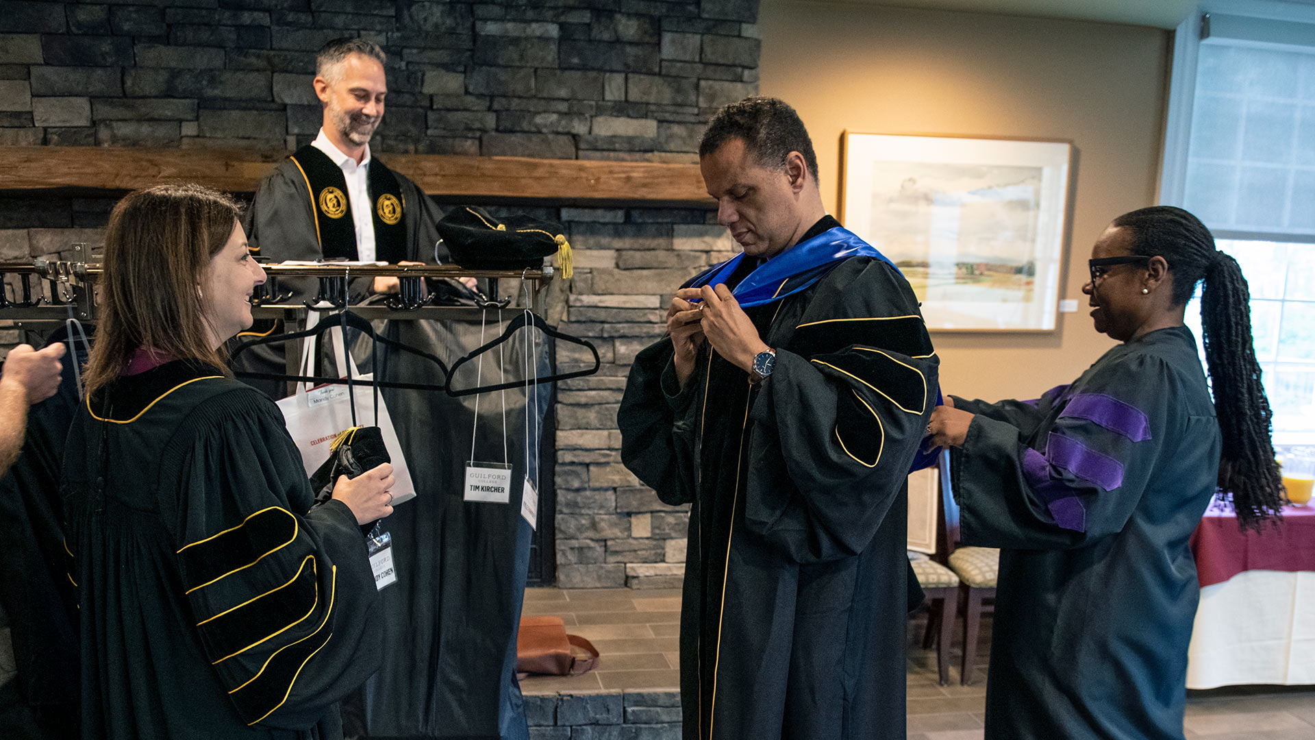 Mandy Cohen, Steve Mencarini, Kyle Farmbry and Meredeth Summers don their robes