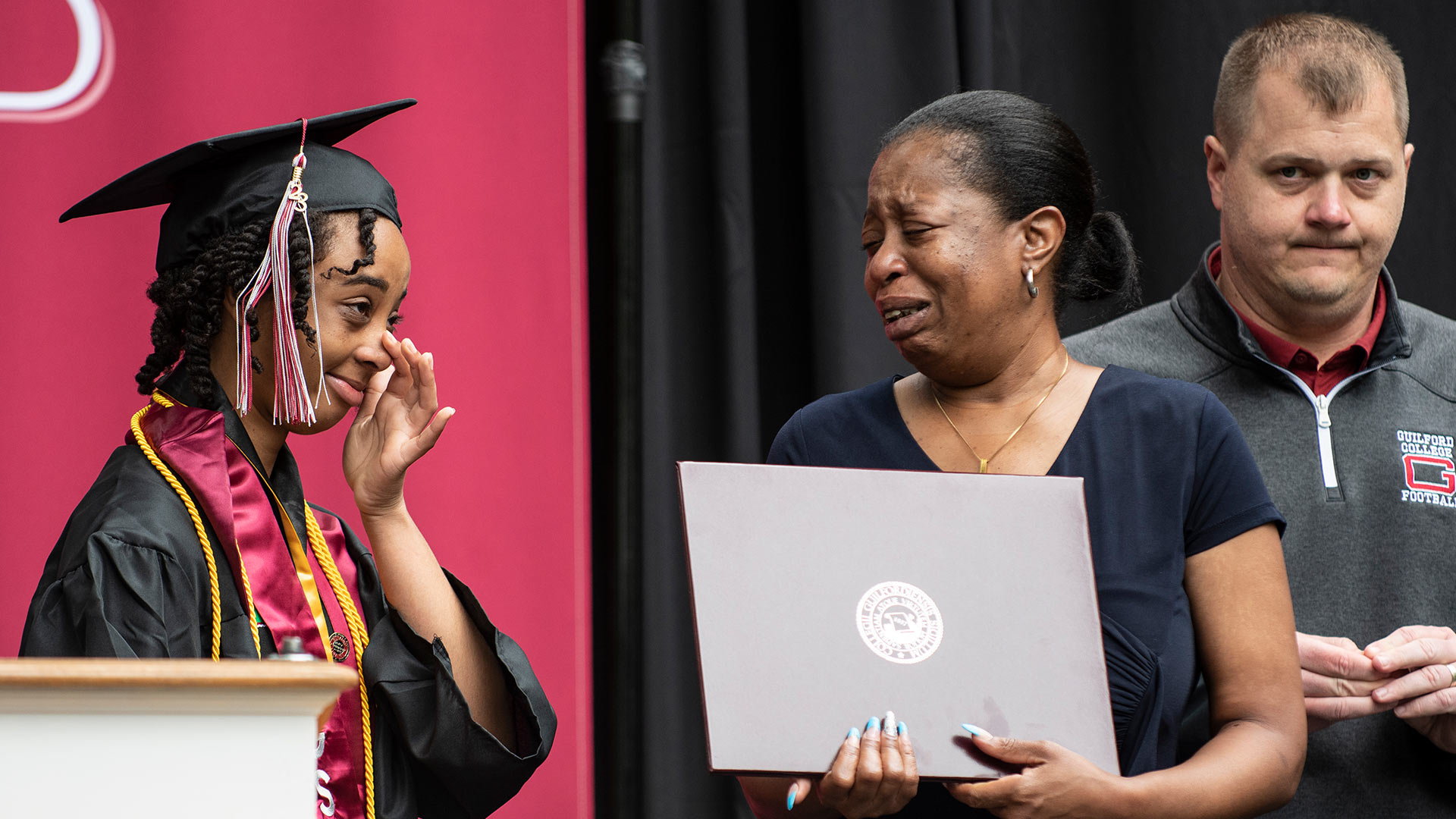Presentation of an honorary Bachelor’s Degree to the family of Ahmad Brewington '23 by Tinyah Ervin ’23 and Brad Davis ’08